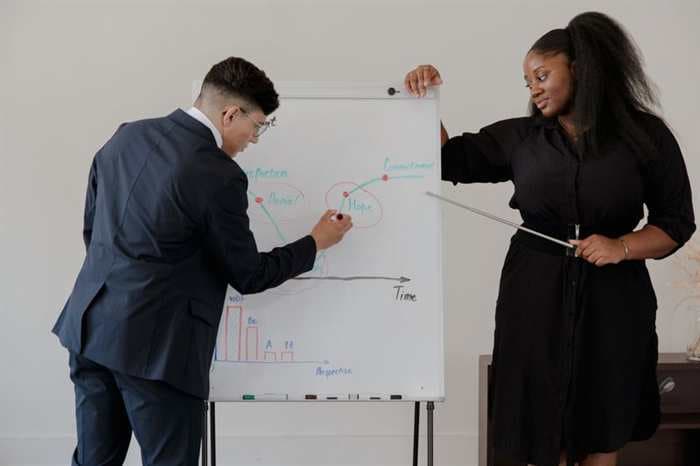A professional smiling during a one-on-one career self-assessment